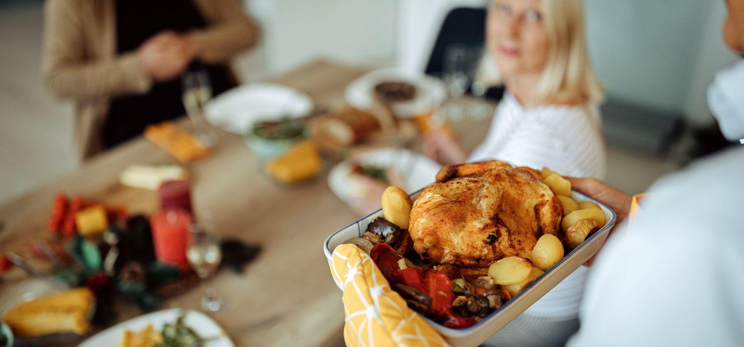 taking a cook chicken to guests