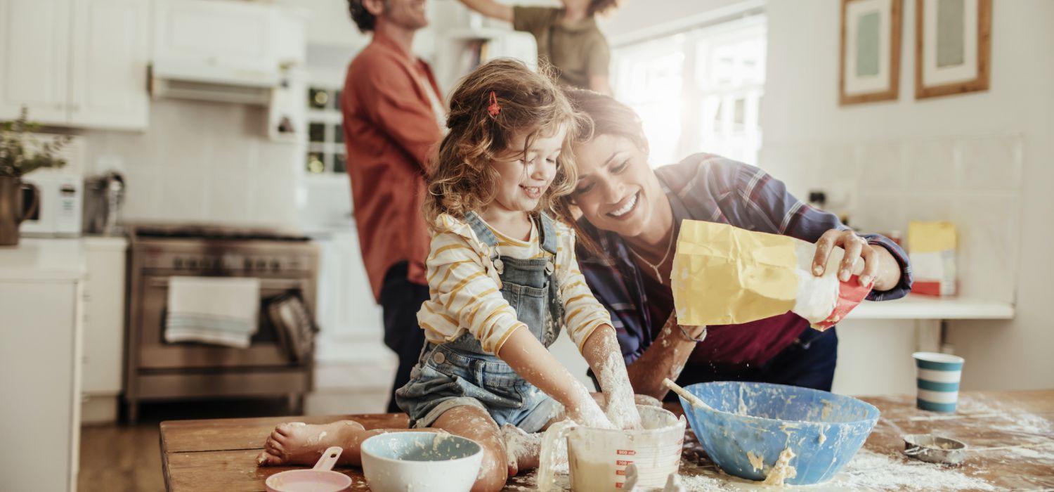 Kids cooking with parents and having fun