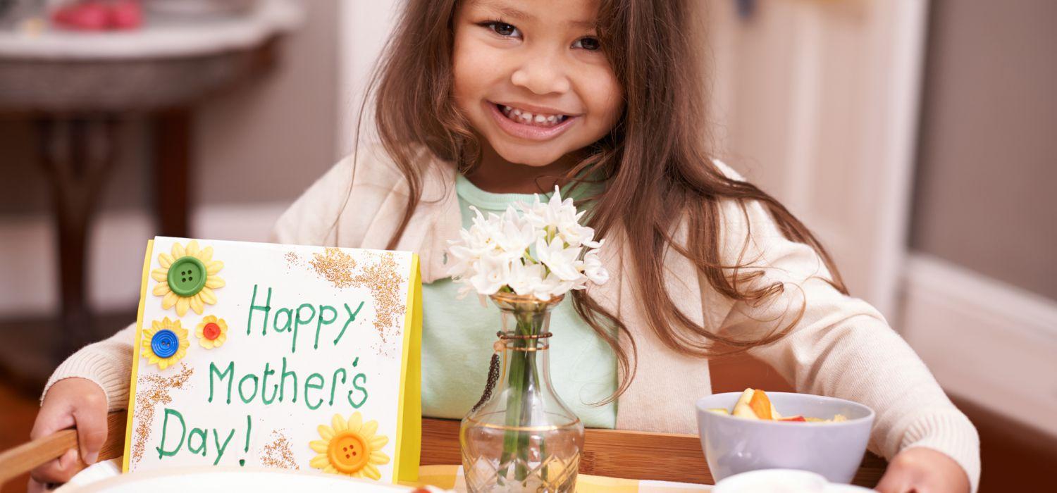 daughter bring food on try with happy mothers day card